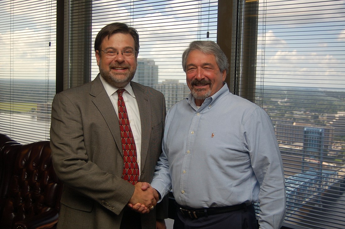 Tad Delegal, president of The Jacksonville Bar Association board of governors, left, and Jim Bailey, executive director of the association.