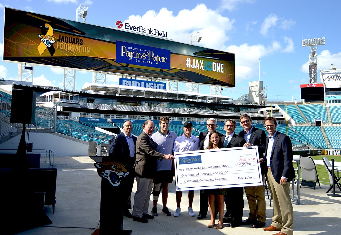 The Jacksonville Jaguars Foundation accepts a donation from Pajcic & Pajcic in a ceremony at EverBank Field.