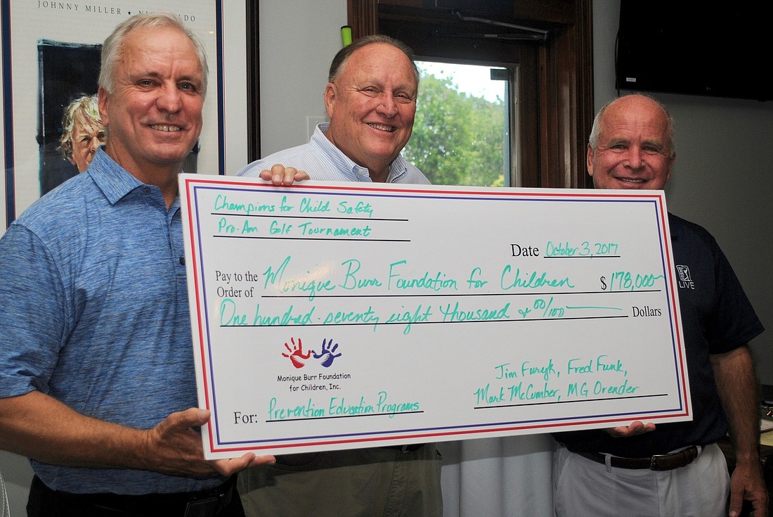 From left, foundation Chairman Ed Burr, Tournament Chairman MG Orender and Honorary Chair Mark McCumber. Fred Funk and Jim Furyk also served as honorary chairs of the tournament.