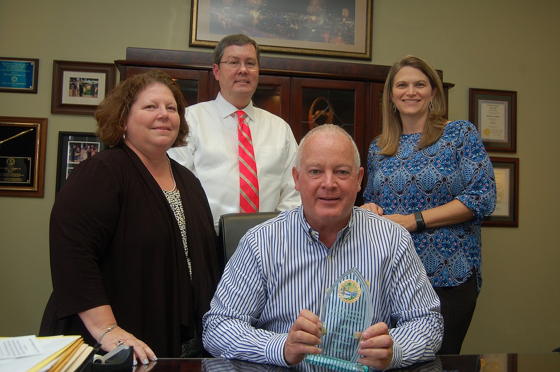 Chief Financial Officer Debra Doran, Chief Operations Officer Michael Love, Tax Collector Michael Corrigan and Chief Administrative Officer Sherry Hall. Corrigan is holding the 2017 Legacy Award.