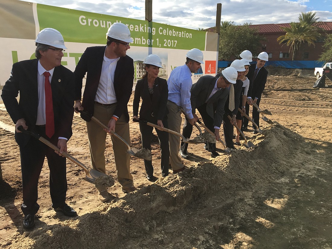 Officials break ground Wednesday on Lofts at Monroe, an affordable housing complex near the Duval County Courthouse.