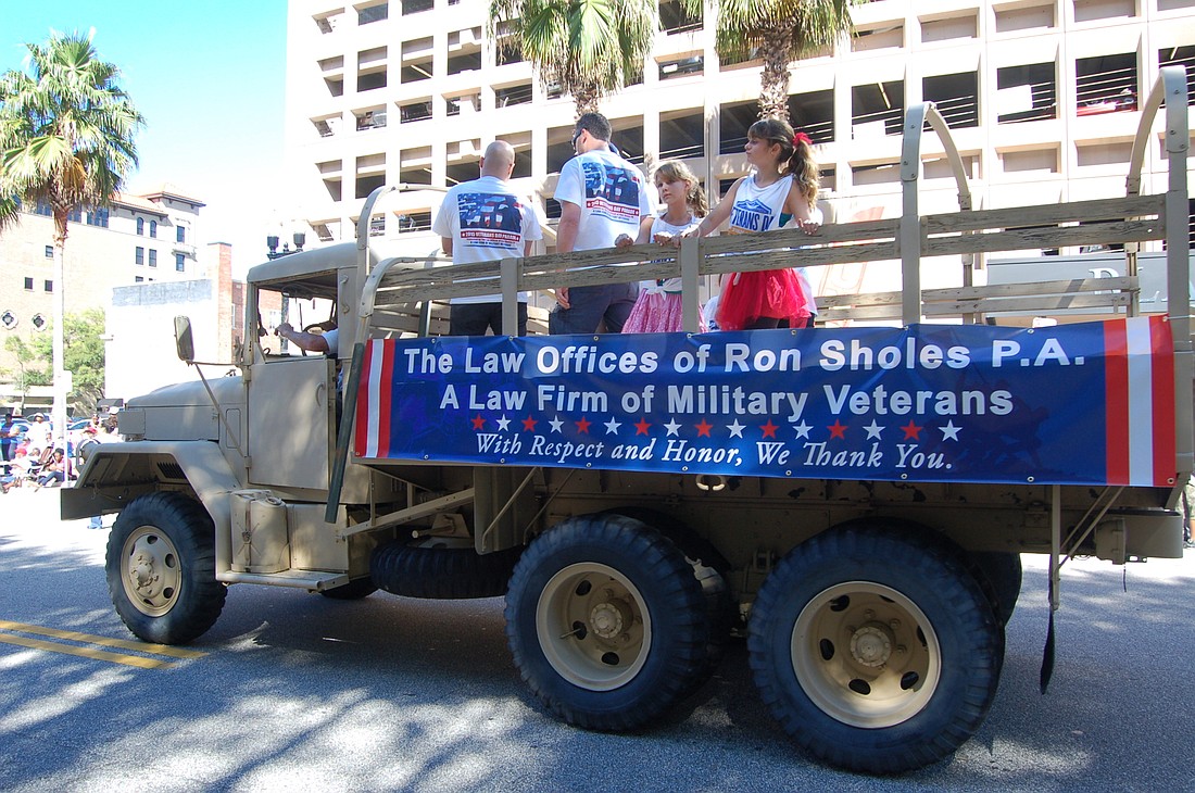 The Law Offices of Ron Sholes is the presenting sponsor for the cityâ€™s annual Veterans Day Parade on Saturday, and will be through 2021.