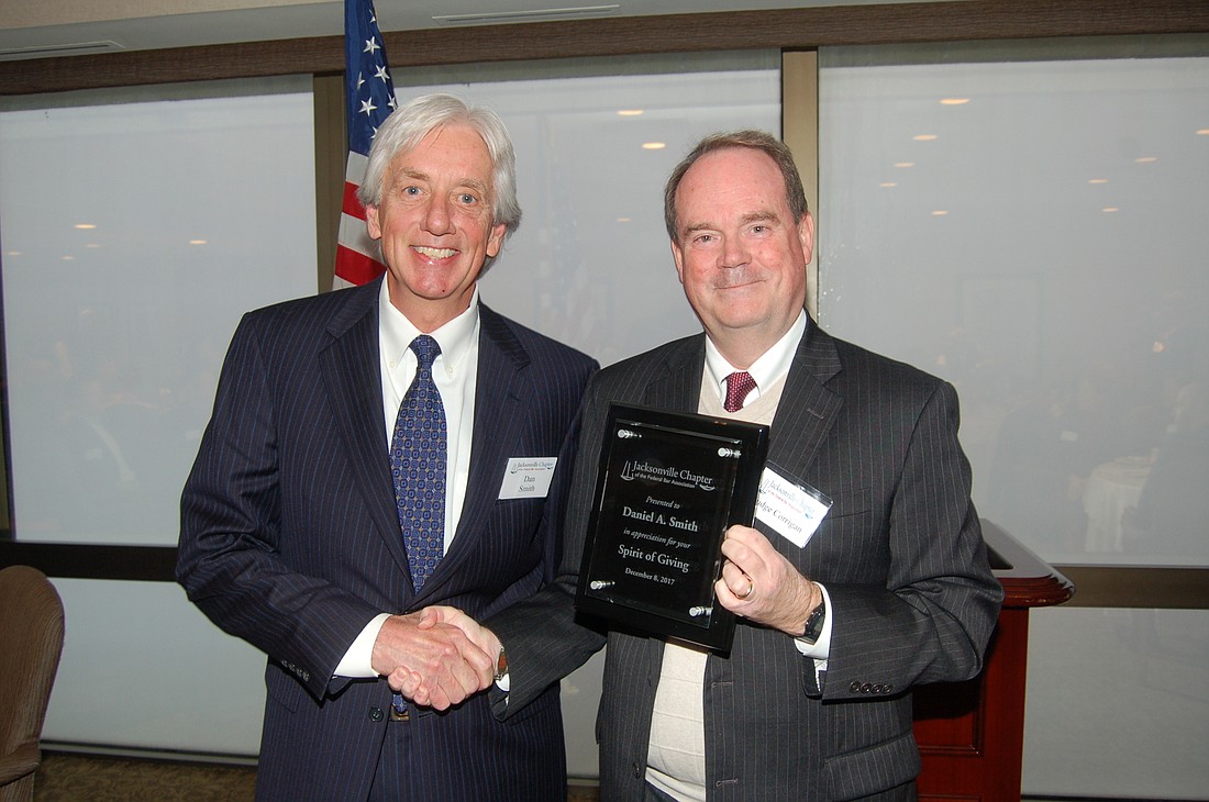 U.S. District Judge Timothy Corrigan, right, presented the Jacksonville Chapter of the Federal Bar Associationâ€™s 2017 Spirit of Giving Award to attorney Daniel Smith.