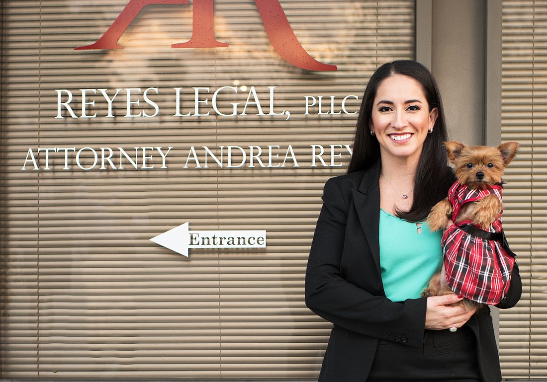 Attorney Andrea Reyes and Reyes Legal office mascot, â€œPeanut.â€