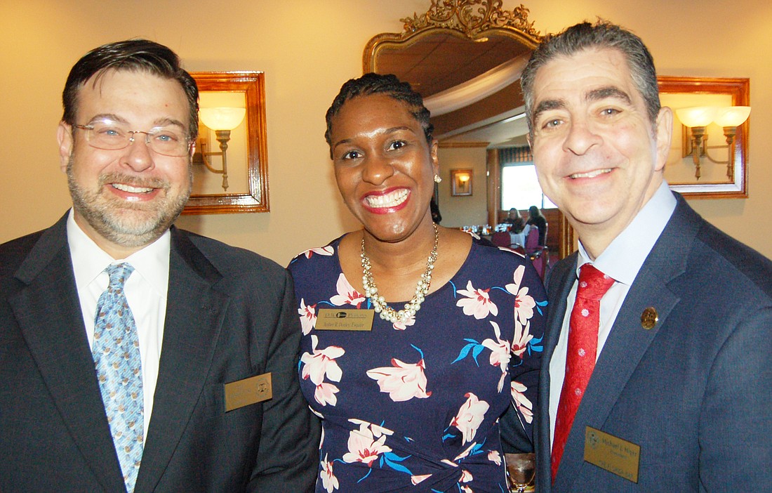 The Jacksonville Bar Association President Tad Delegal, left, with D.W. Perkins Bar Association President Amber Donley and Miami attorney Michael Higer, president of The Florida Bar.