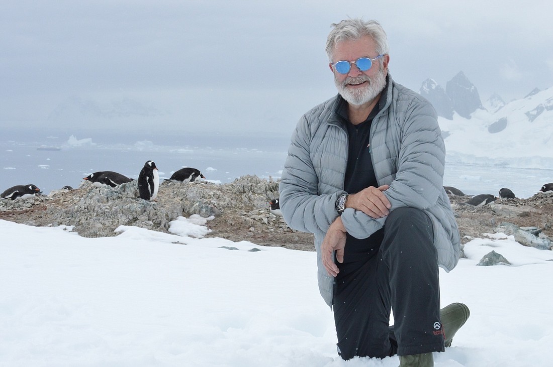 McGuireWoods partner Scott Cairns on Danco Island in Antarctica with some of the more than 3,000 gentoo penguins which are the only year-round inhabitants of the island.