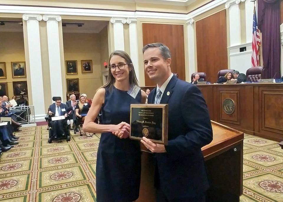 Akerman associate attorney Allison Stocker accepted the 2018 Young Lawyers Division Pro Bono Service Award from Young Lawyers Division President Zackary Zuroweste at a ceremony Thursday at the state Supreme Court.
