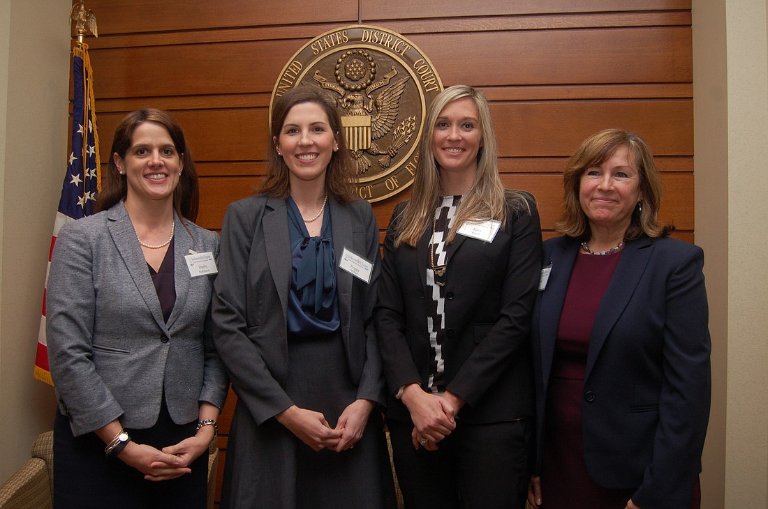 From left, law clerks Darby Robinson, Peggy Miller, Kara Wood and Susanne Weisman participated Thursday in a panel discussion about federal court operations presented by the Jacksonville Chapter of the Federal Bar Association.
