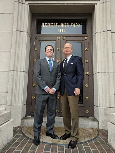 Attorney Justin Kempf and his mentor, O. David Barksdale, of Bedell, Dittmar, DeVault, Pillans & Coxe.