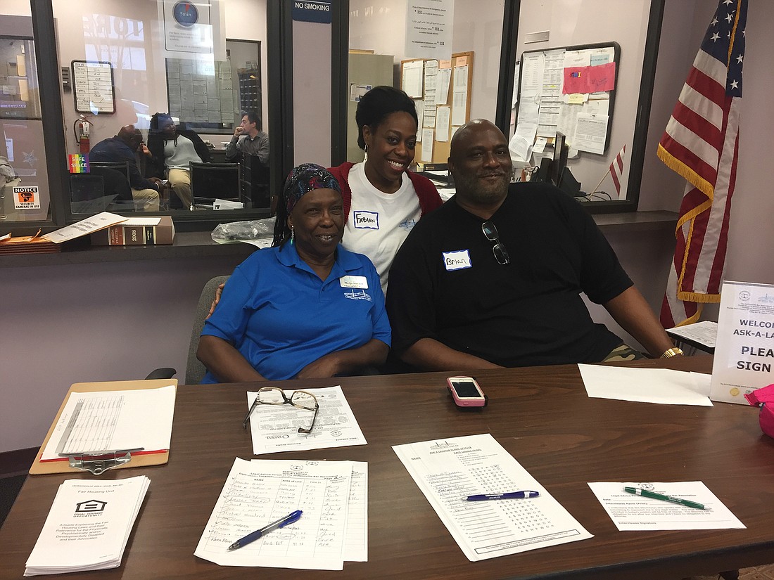 Client Advisory Board members Phyllis Maxwell, Fabian Jackson and Brian Jones welcomed attendees and helped them sign in for Ask-A-Lawyer.