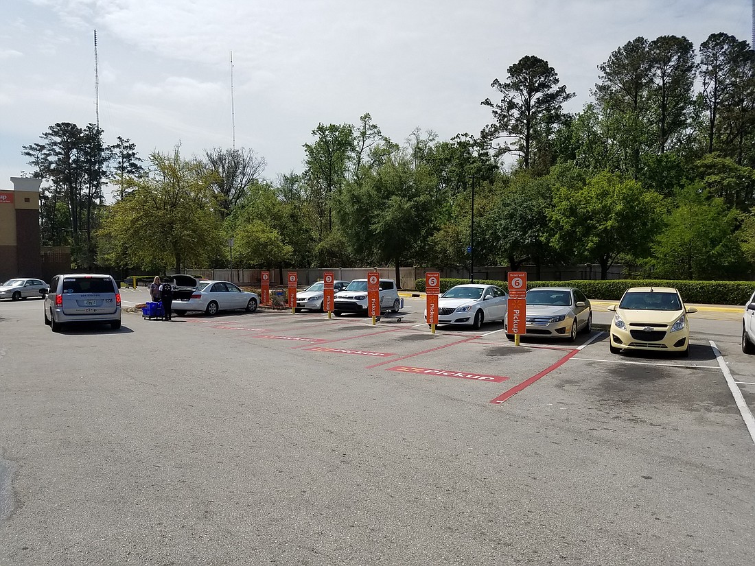 The Walmart Supercenter at  8808 Beach Blvd. has six parking spots reseserved for customers picking up merchandise. For grocery items, customers can stay in their cars while Walmart workers bring out their orders.