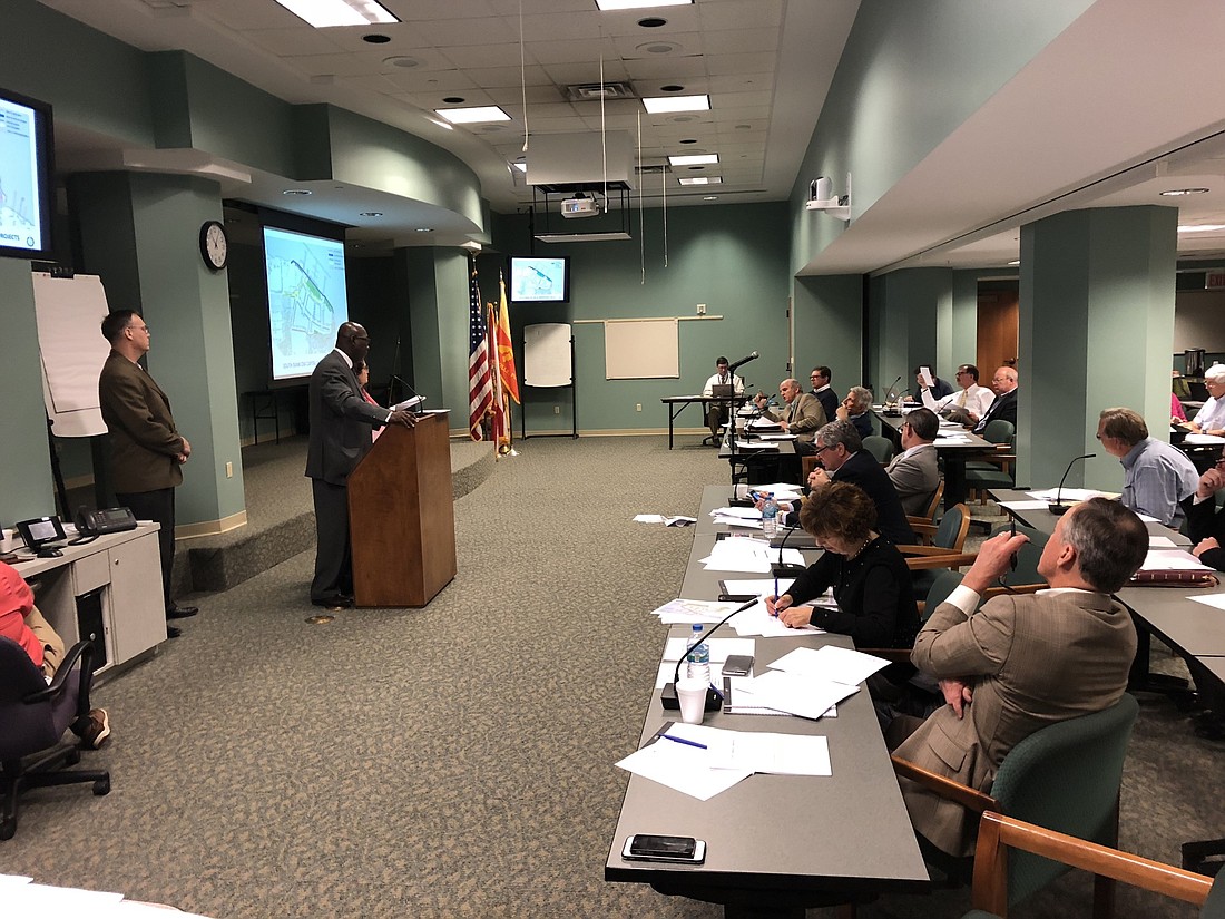 Downtown Investment Authority CEO Aundra Wallace, at the podium, presented the framework Monday for a deal that would have his agency fund $26.4 million in infrastructure improvements for The District mixed-use development.