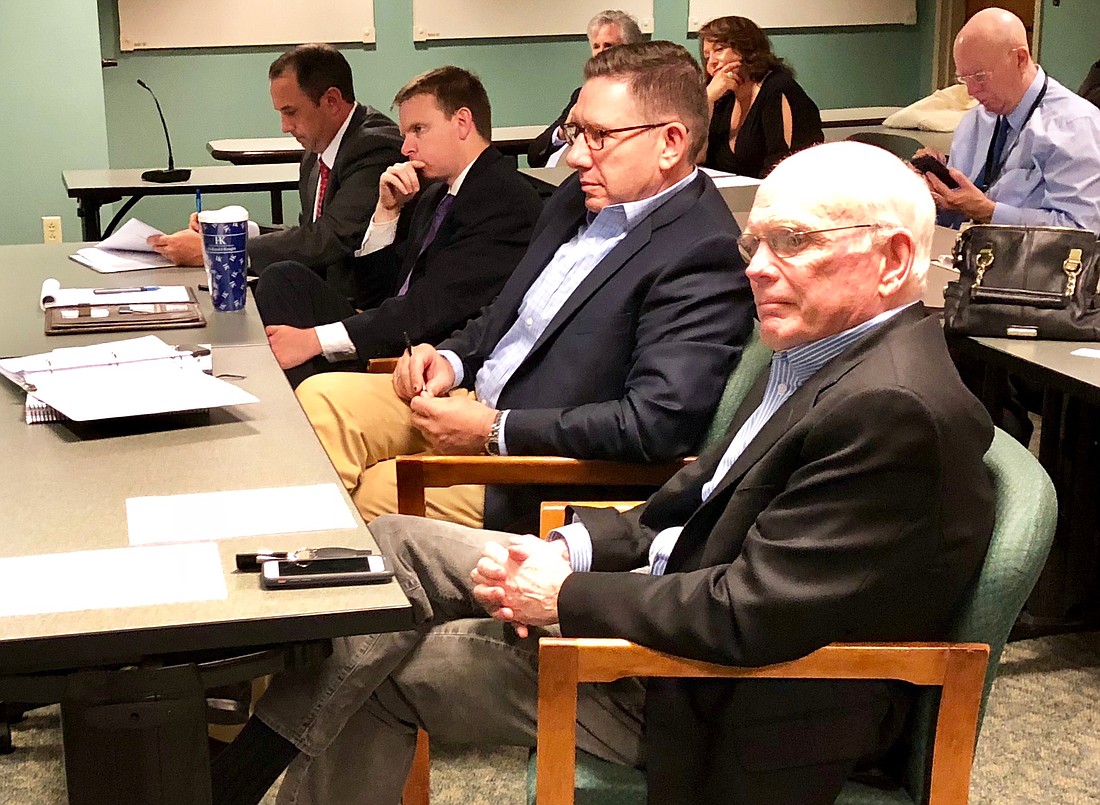 Developers Michael Munz and Peter Rummell watch as the Downtown Investment Authority approves their plans for The District, a Southbank mixed-use project, at its meeting Wednesday.