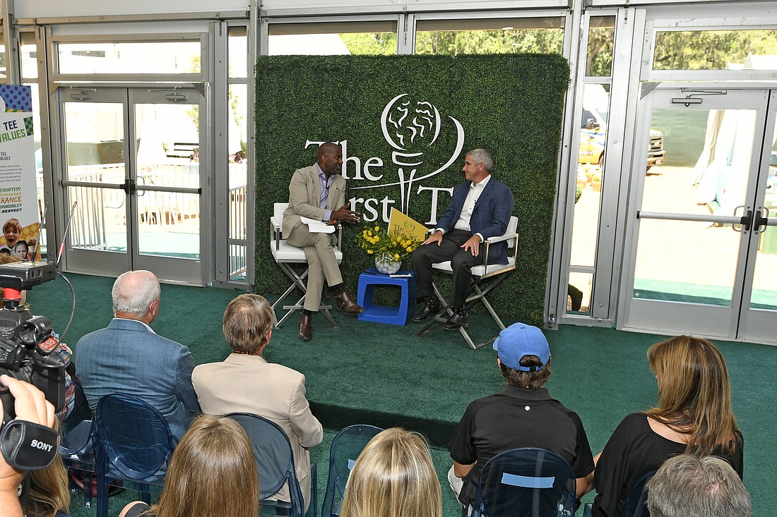 First Tee CEO Keith Dawkins (left) and PGA Tour Commissioner Jay Monahan speak at The First Tee Experience.  (Photo by Stan Badz, PGA Tour)