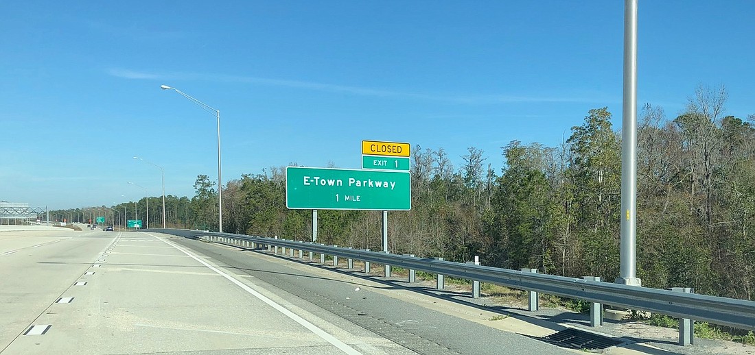 The still-closed exit to eTown can be seen along northbound Interstate 295. There also is a southbound exit sign.