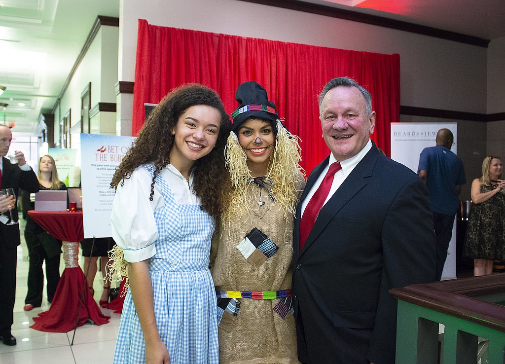 Dorothy and the Scarecrow with Circuit Judge David Gooding at the â€œWizard of Ozâ€-themed â€œThereâ€™s No Place Like Homeâ€ gala that benefits the Guardian ad Litem child advocacy program.