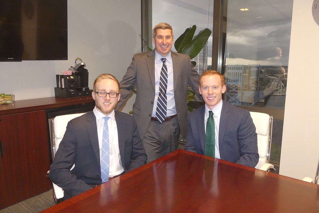 Charles Jimerson with Jimerson & Cobbâ€™s summer associates, John Rutledge, a student at the University of Florida Levin College of Law, left, and Evan Reid, whoâ€™s studying at Wake Forest University School of Law.