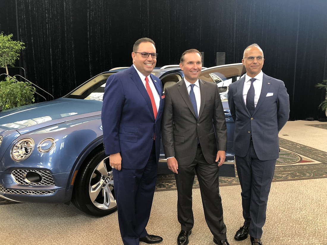 Mario Murgado, president and CEO of South Florida-based Brickell Motors LLC, Mayor Lenny Curry and Bentley President and CEO Mark Del Rosso.