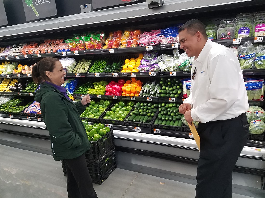 Walmart Neighborhood Market Store Manager Paul Rodriguez reviews final preparations for opening the store on Baymeadows Road with Debi Bush, the "fresh assistant manager" at the business that opensÂ Wednesday.