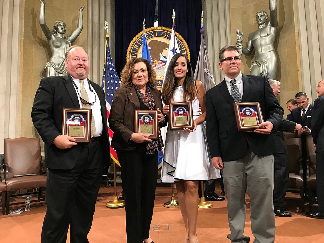 Special to the Daily Record U.S. Attorney Maria Chapa Lopez, second from left, Administrative Officer Jeff Hahn, Assistant U.S. Attorney Ilianys Rivera Miranda and Office Manager/IT Specialist Joey Chigro.