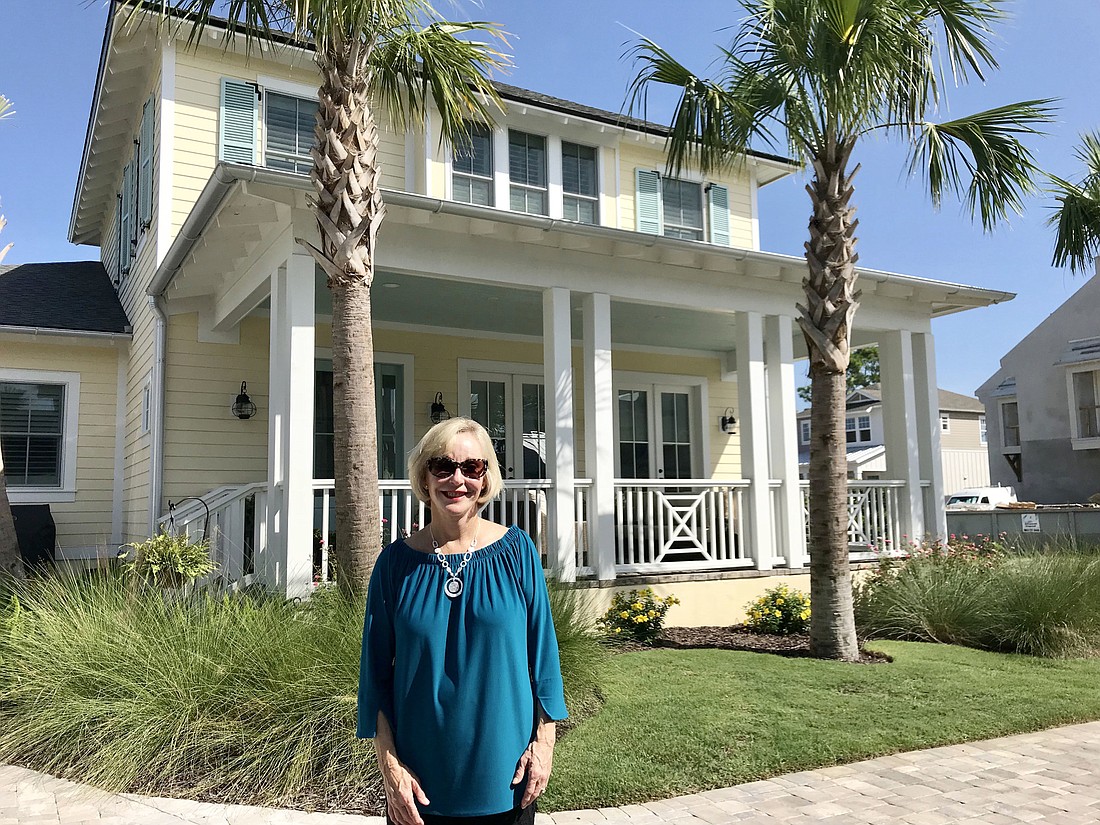 Jan Shields stands in front of an Atlantic Beach home she recently listed for sale. She was ranked 24th for selling $69.5 million in homes in 2017. Photo by Jay Schlichter