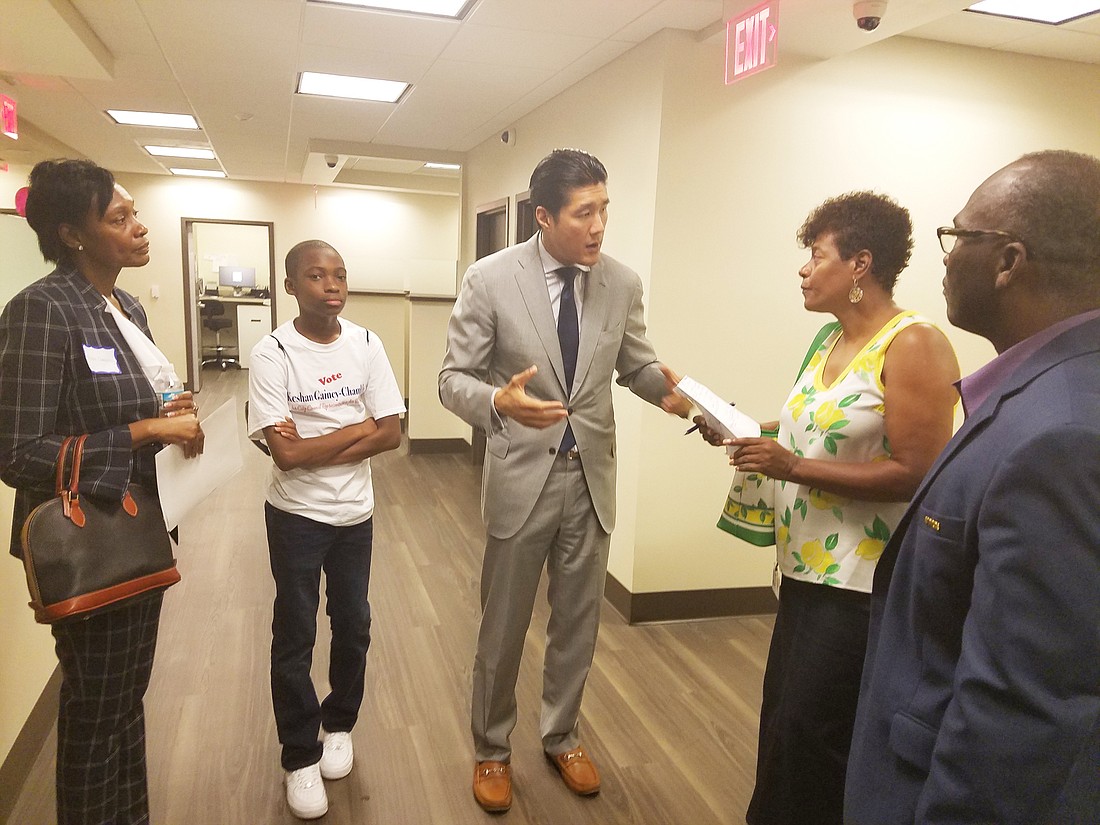 From left, Jacksonville City Council candidate Keshan Gainey-Chambliss, her son, Elijah, ChenMed CEO Christopher Chen, state Rep. Kimberly Daniels and council member Reggie Gaffney tour the ChenMed Dedicated Senior Medical Center.