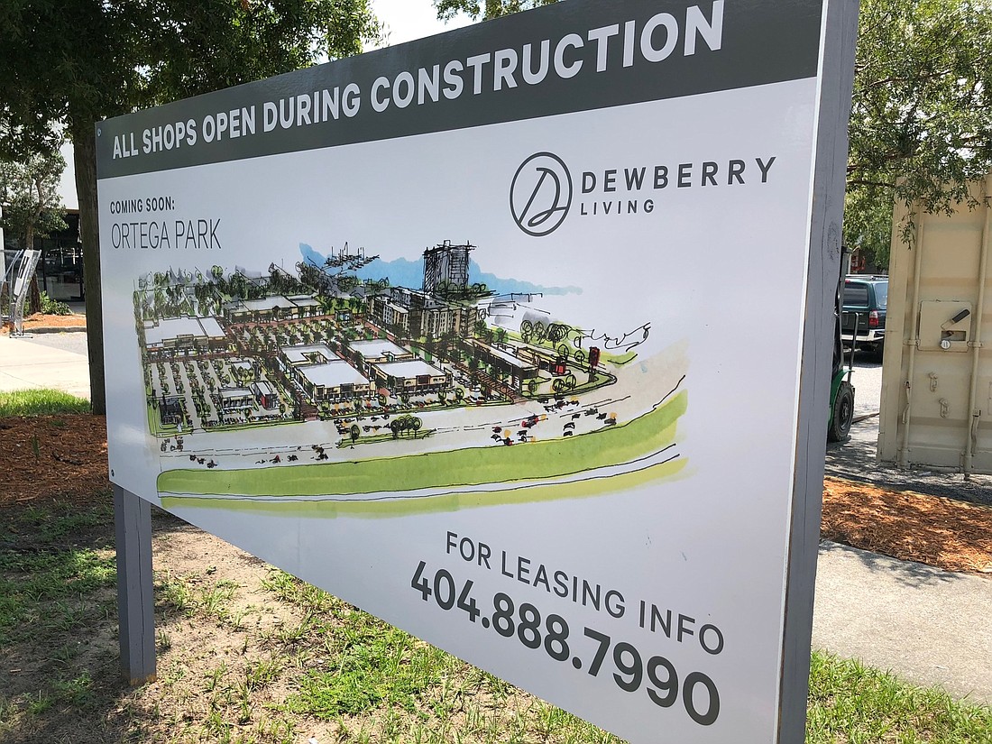 Signs at the Roosevelt Square shopping center display renderings with the property named Ortega Park. They show what appears to be an apartment building near the former Belk store site and a retail plaza called Ortega Alley.