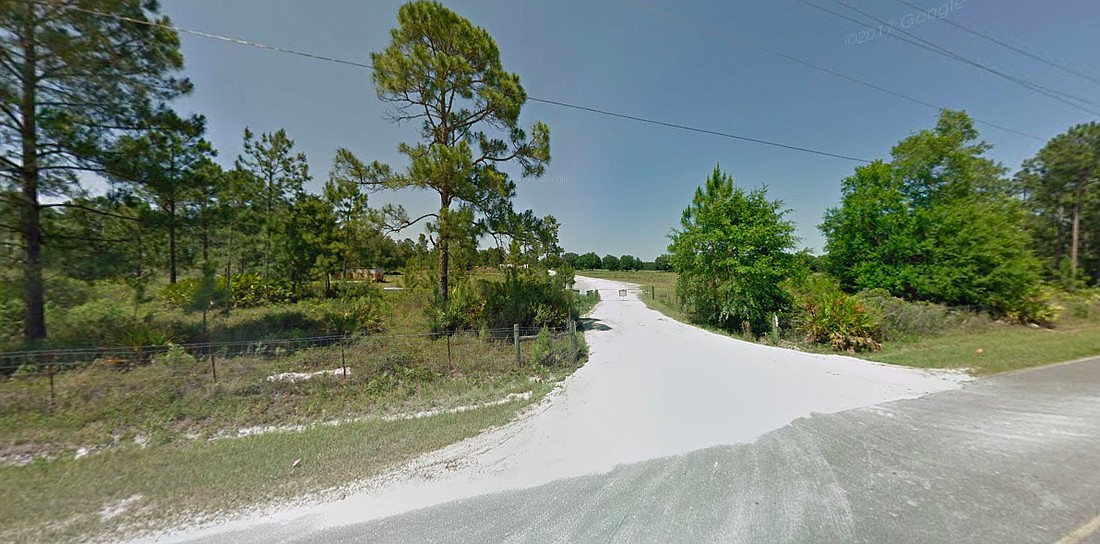 This undeveloped land on the north side of Kindlewood Drive near State Road 23 in Clay County has been selected for a proposed single-family home development called Cameron Oaks. Screenshot via Google street maps.