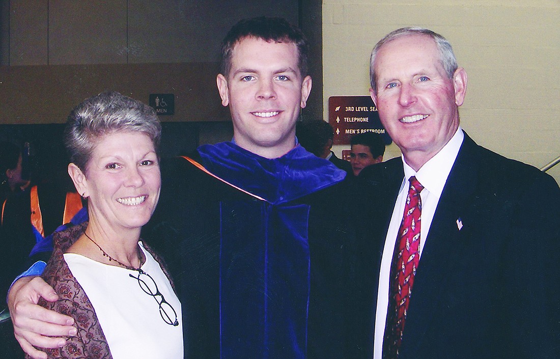 Brian Coughlin with his parents, Tom and Judy, when he graduated from the University of Florida Levin College of Law in 2003.