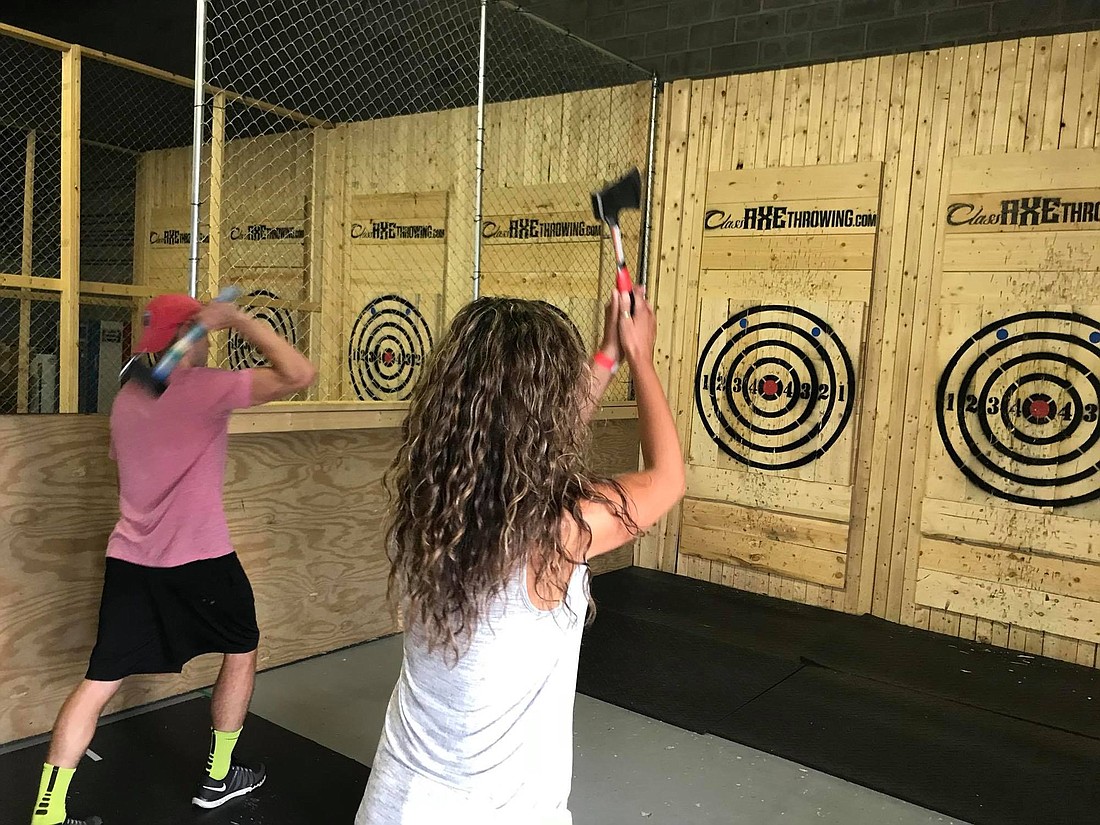 Participants at the Cleveland Axe Throwing Class Axe target the bullâ€™s-eye. Thirteenth Floor Entertainment Group is bringing the venue to Regency Court Shopping Center in Arlington at the end of the month.