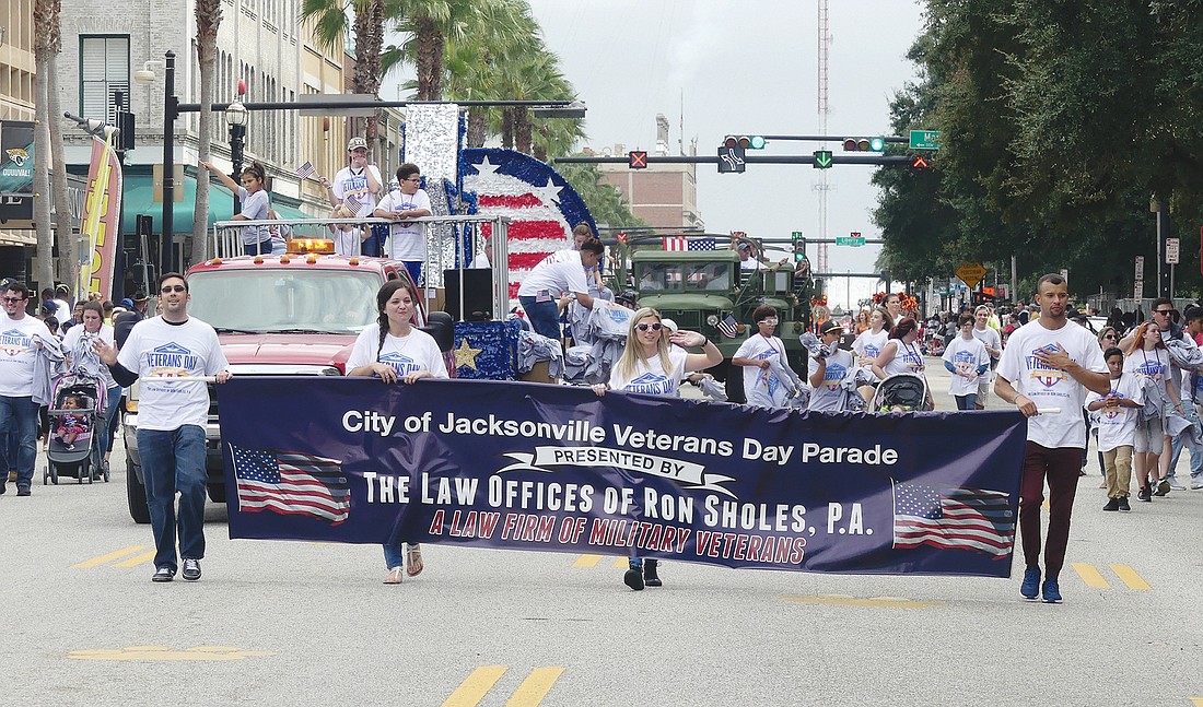 The Law Offices of Ron Sholes sponsored the cityâ€™s Veterans Day Parade on Monday and led the procession Downtown from the Sports Complex to the Prime Osborn Convention Center.