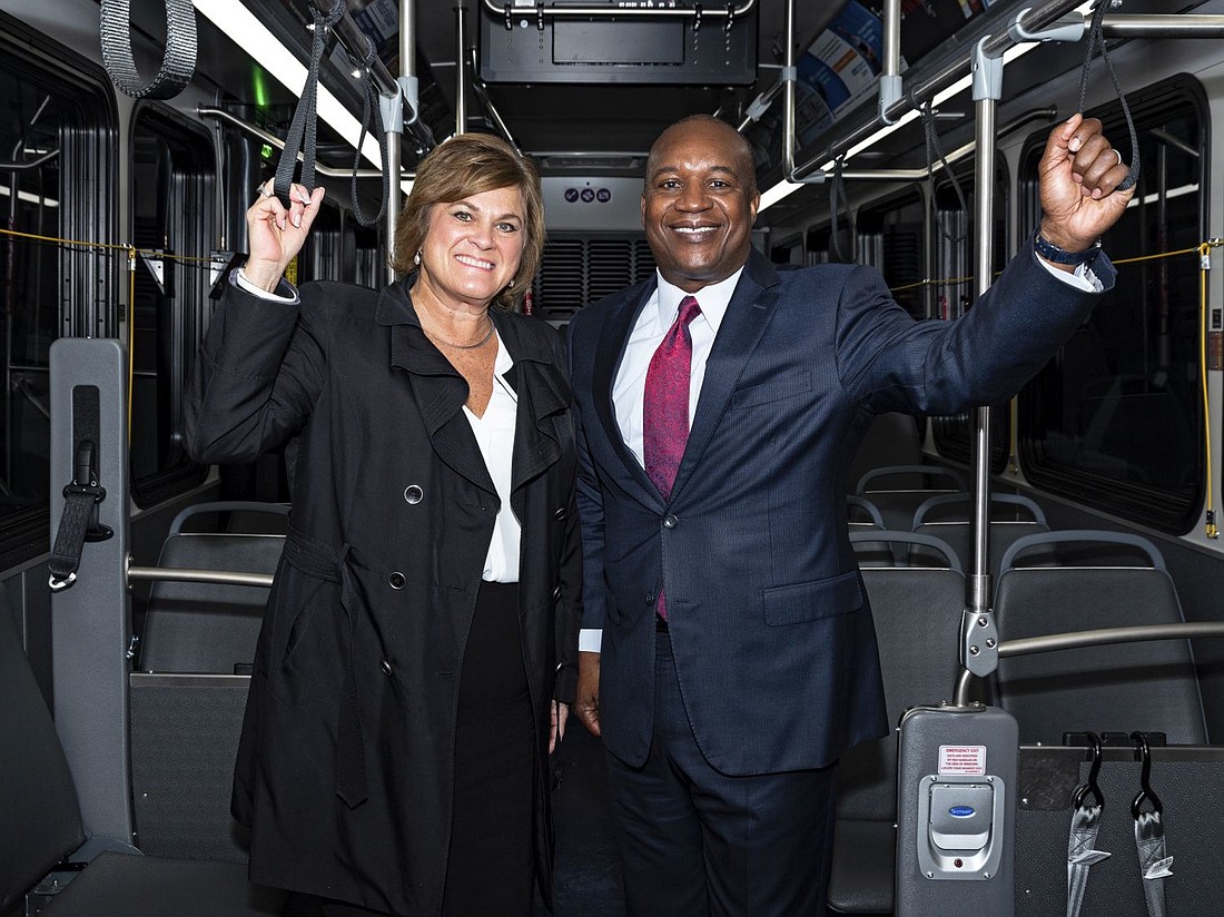 K. Jane Williams, acting administrator of the Federal Transit Administration and JTA CEO Nathaniel Ford ride the First Coast Flyer Red Line to Jacksonville Beach.
