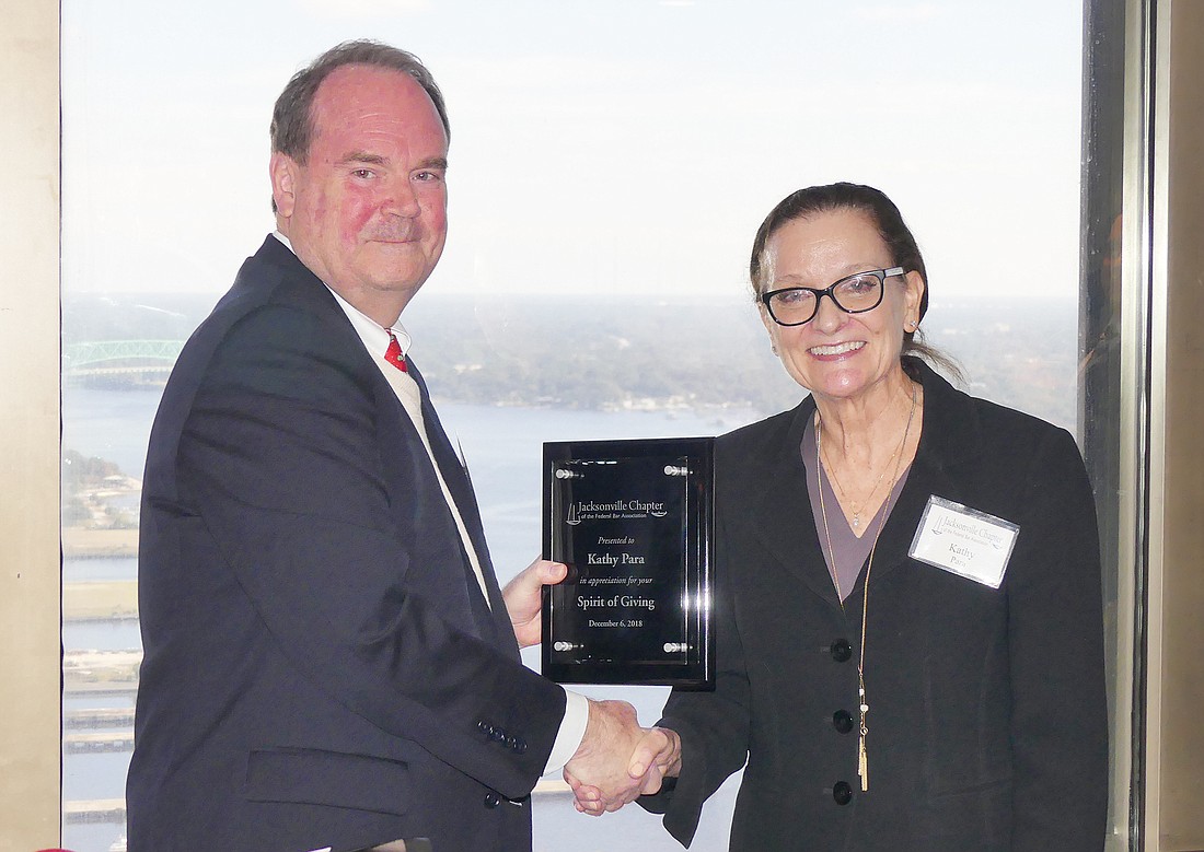 U.S. District Judge Timothy Corrigan presented a Spirit of Giving Award to Jacksonville Area Legal Aid Pro Bono Director Kathy Para at the The Jacksonville Chapter of the Federal Bar Associationâ€™s annual â€œSpirit of Givingâ€ awards luncheon.
