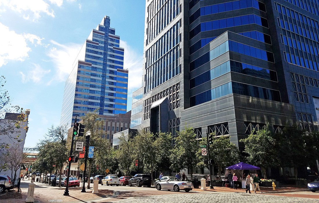The SunTrust Tower, left, and the Bank of America Tower. SunTrust is moving to the Bank of America Tower to make way for VyStar, which plans to move its headquarters Downtown this year.