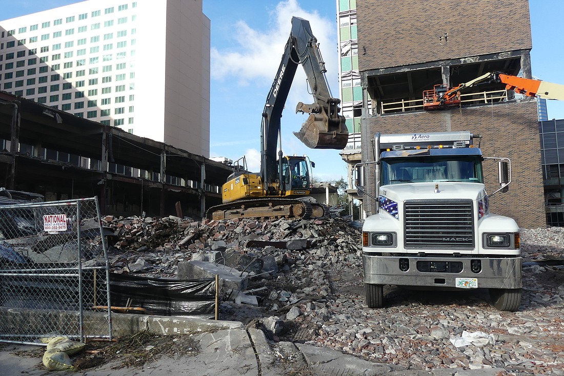 Demolition workers continued their work Wednesday on the former City Hall Annex building at 200 E. Bay St. Workers are preparing the building for implosion on Jan. 20.