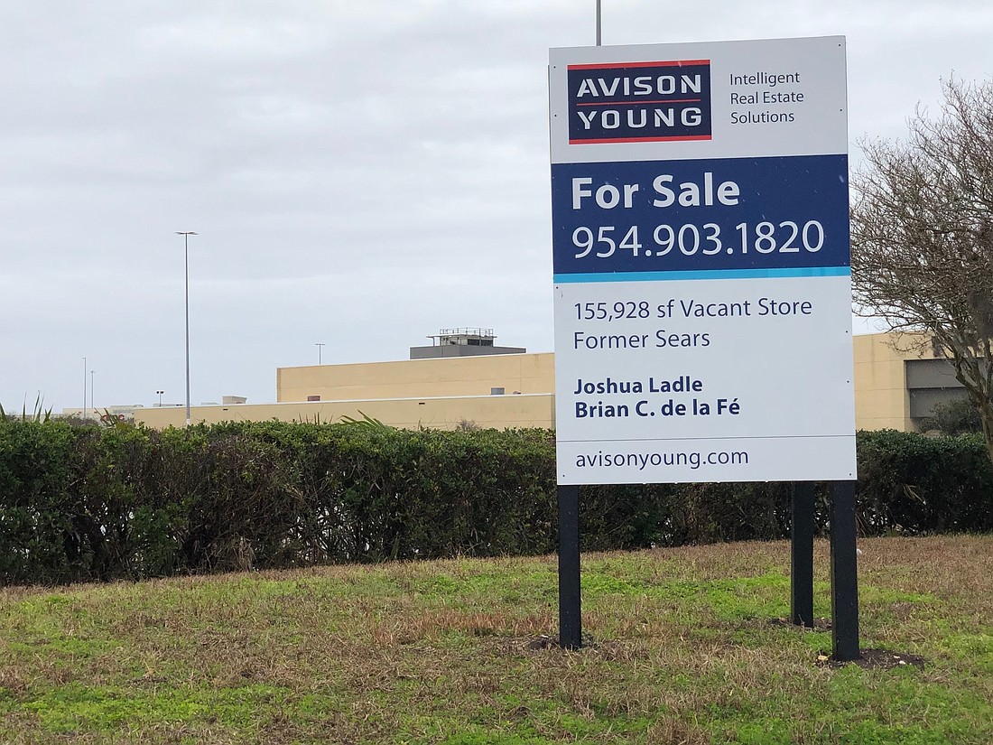 A sign at the closed Sears store at Regency Square Mall shows that Avison Young is listing it for sale.