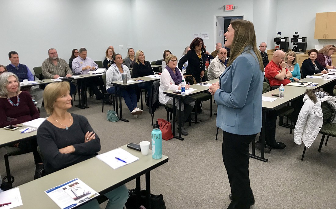 Cynthia DeLuca, a real estate instructor since 2002, leads a course on â€œClarifying Service Animalsâ€ to about 50 real estate professionals.