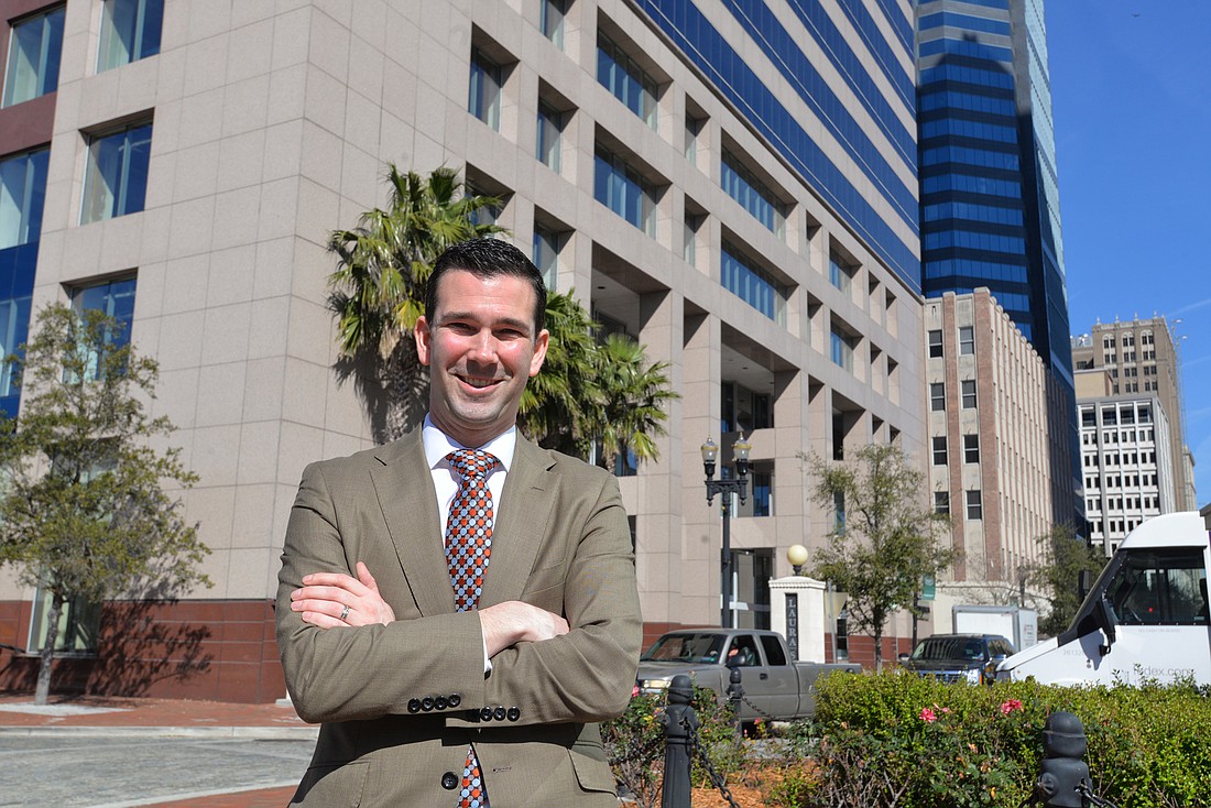 VyStar President and CEO Brian Wolfburg outside what will become his companyâ€™s headquarters Downtown at 76 S. Laura St. VyStar bought the SunTrust Tower in July for $59 million.