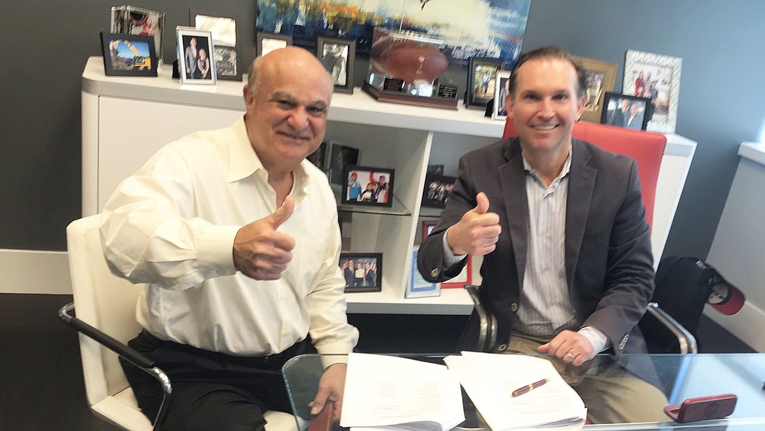 Sleiman Enterprises Inc. President Toney Sleiman, owner of the Jacksonville Landing, and Jacksonville Mayor Lenny Curry reached a deal on the future of the Downtown shopping center Wednesday. (Photo is from Curry&#39;s Twitter)