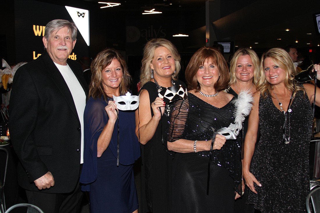 Laurel Award sponsor Rita Williams of Merchandising Plus, fourth from left, attends the event with her family, from left, husband Warren Powers and daughters Alaine, Tammy, Dawn and Terry.