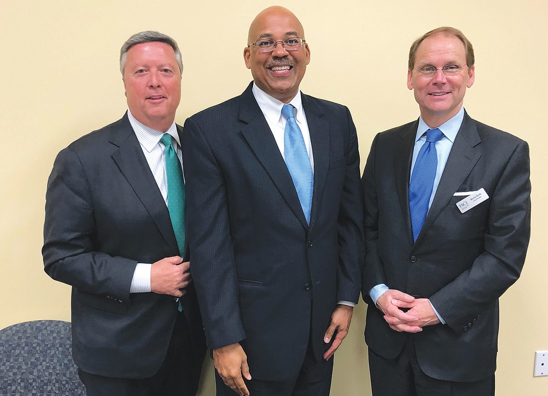 From left, Jacksonville University President Tim Cost, University of North Florida Coggin College of Business Dean Mark Dawkins and Florida State College at Jacksonville interim President Kevin Hyde.