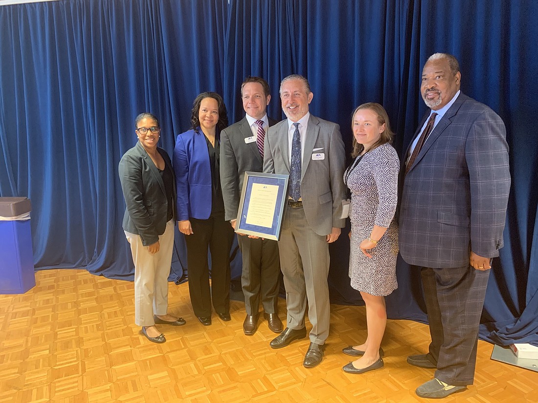 From left, JEA board Vice Chair Camille Lee-Johnson, board Chair April Green, JEA CEO Aaron Zahn, outgoing board Chair Alan Howard and board members Kelly Flanagan and The Rev. Frederick Newbill.