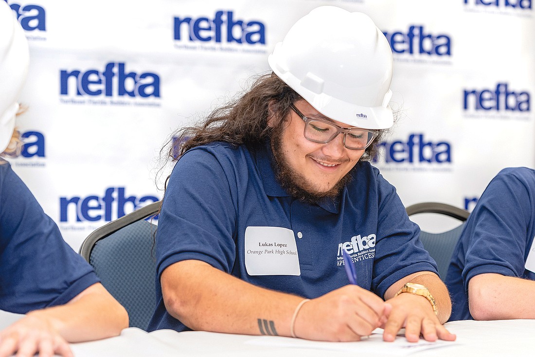 Lukas Lopez of Orange Park High School signs up for the Northeast Florida Builders Association Apprenticeship Program on April 17 at the University of North Florida Adam W. Herbert University Center.