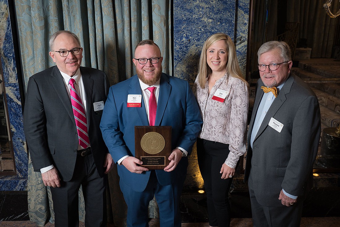 From left, International Academy of Trial Lawyers President J. Mark White, Coker Law partner and academy fellow Daniel Iracki, his wife, Amy Iracki, and Howard Coker, president and founding partner of Coker Law.