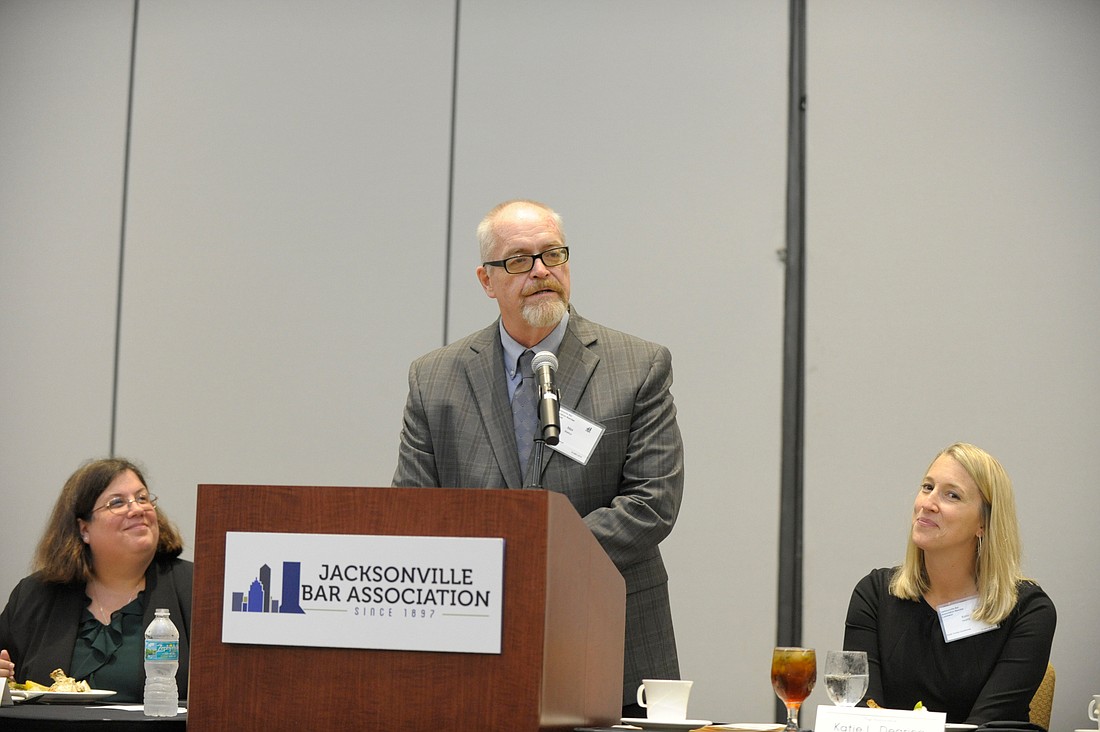 Max Marbut thanks the Jacksonville Bar Association after winning the Liberty Bell Award. Florida Times-Union Editor Mary Kelli Palka, left, and JBA President and Circuit Judge Katie Dearing look on. (Photo by Dede Smith)
