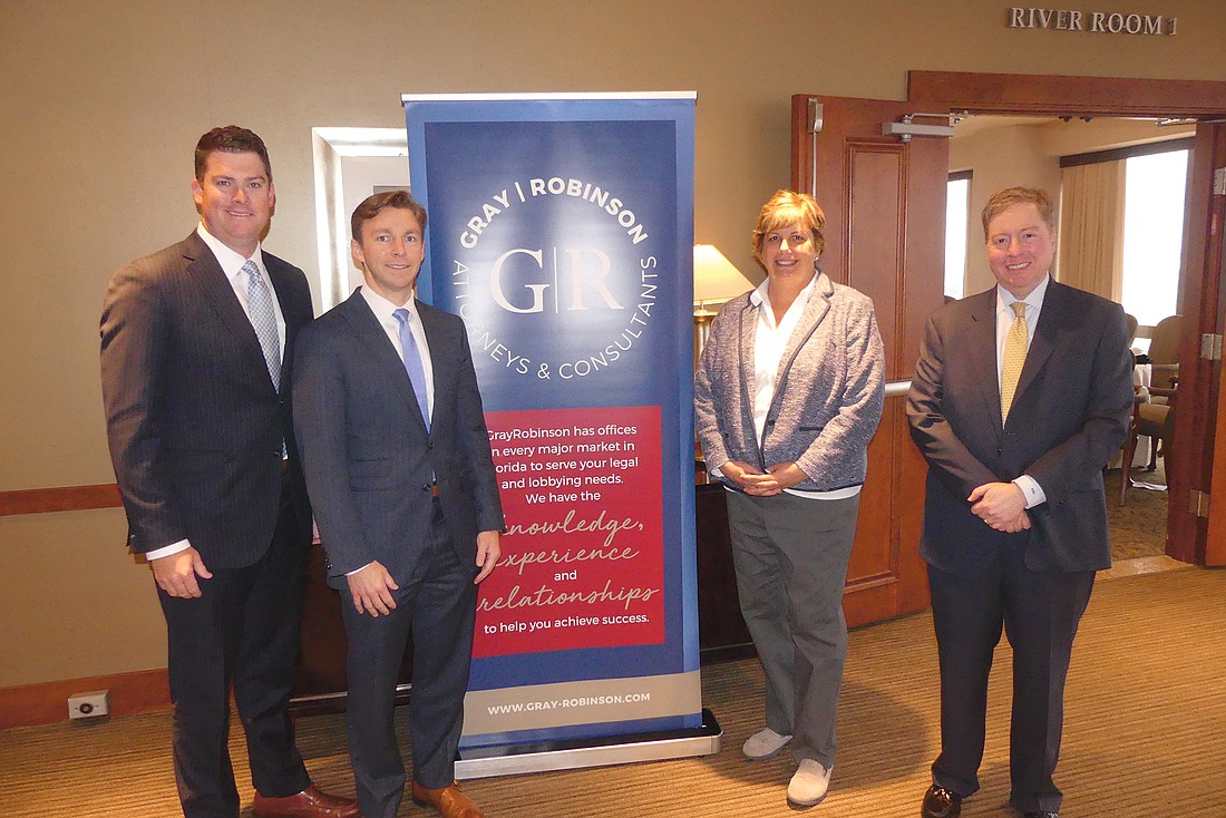 GrayRobinson law firm government affairs consultants, from left, Robert Stuart, Chris Carmody and Kim McDougal with GrayRobinson Jacksonville Managing Director Kenneth Jacobs.