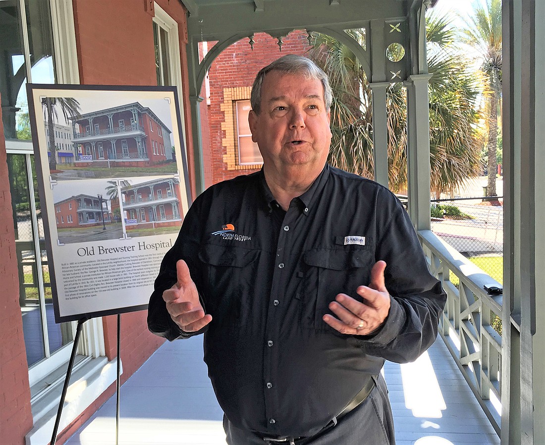 North Florida Land Trust President Jim McCarthy on the front porch of the old Brewster Hospital, which served as a hospital for blacks during the segregation era. The land trust is moving into the historic building in LaVilla.