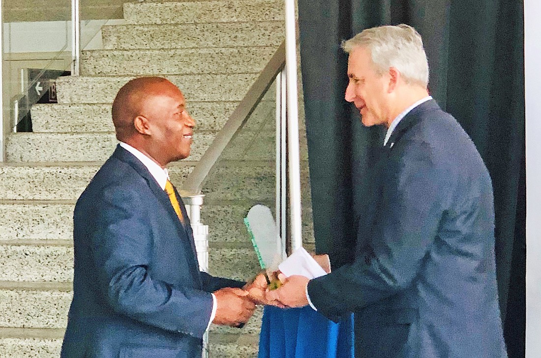 Jacksonville Transportation Authority CEO Nathaniel Ford Sr. receives the 2019 Eno Thought leader Award from Robert Puentes, president and CEO of the Eno Center for Transportation.