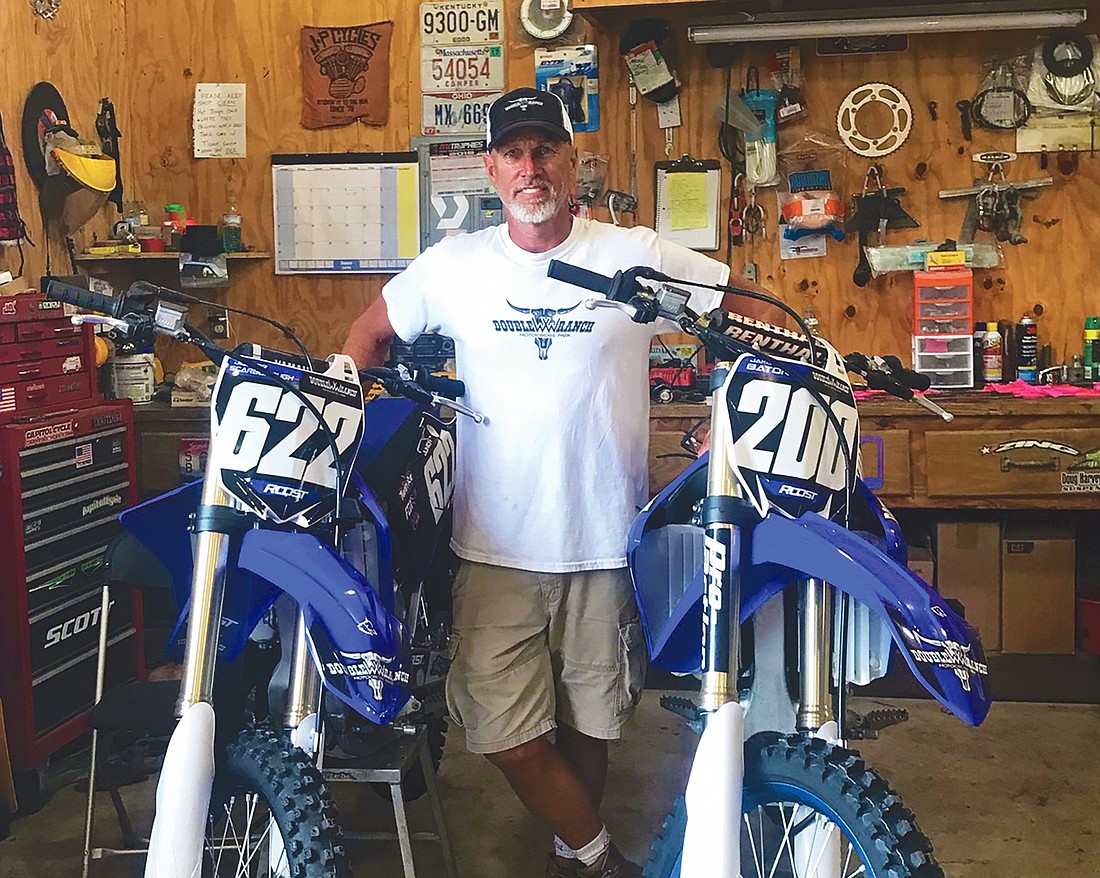 Wayne Scarborough Jr. shows off the type of motor bikes that will race at his familyâ€™s ranch Saturday at the Lucas Oil Pro Motocross Championship.