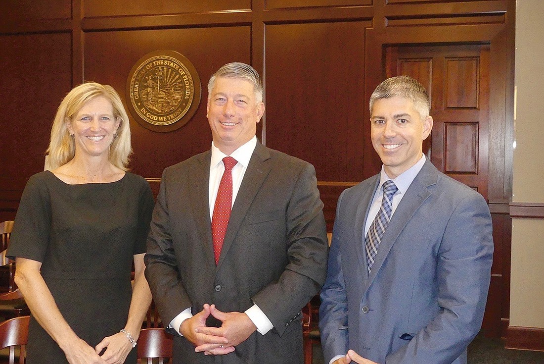 From left, Courtney Grimm, Jacob Brown and Patrick Kilbane. Brown was elected 2019-20 chair of the 4th Circuit Judicial Nominating Commission, succeeding Kilbane. Grimm was elected vice chair.